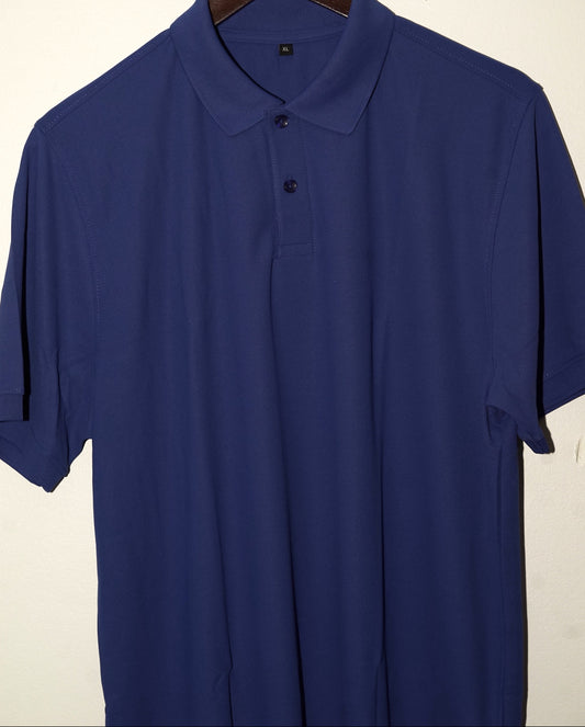 Blue polo shirt on a hanger against a beige background