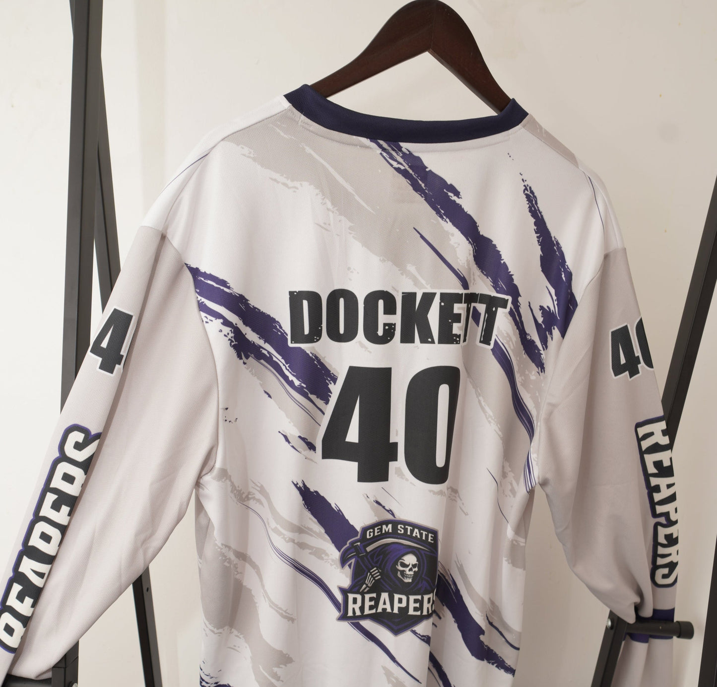 White jacket with black text and graphics on a white background