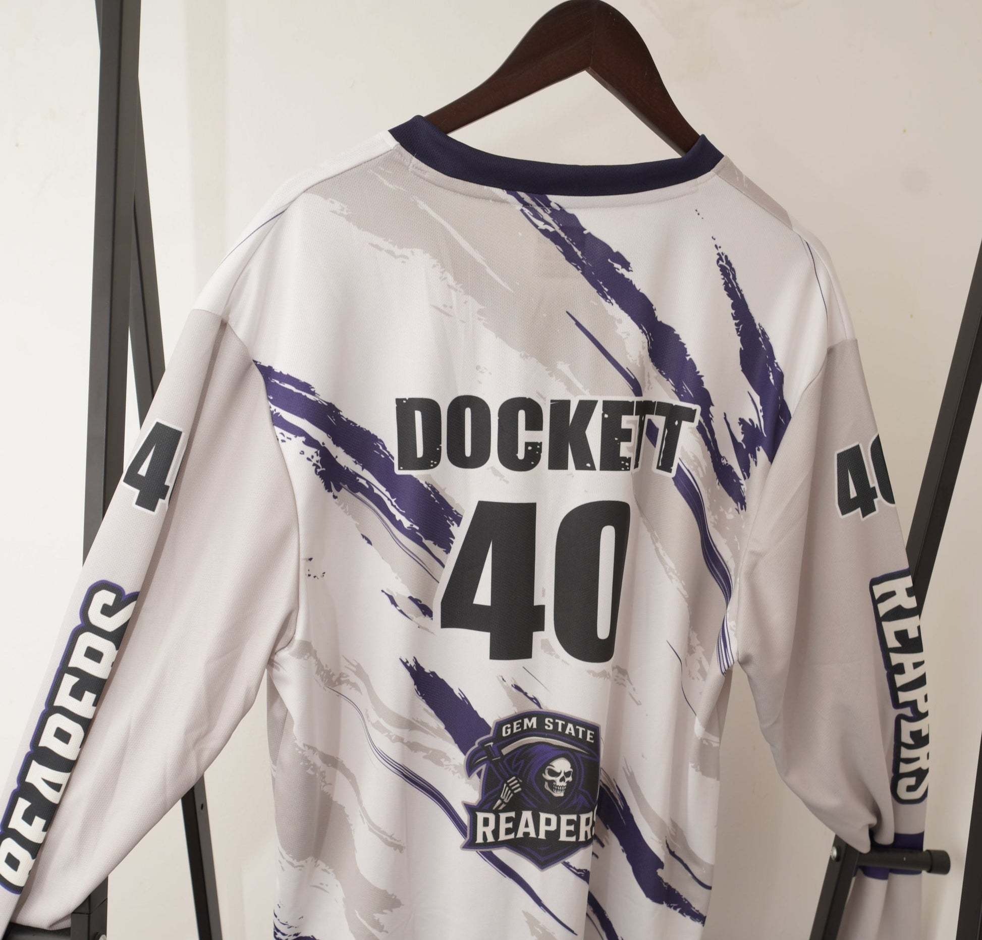 White jacket with black text and graphics on a white background