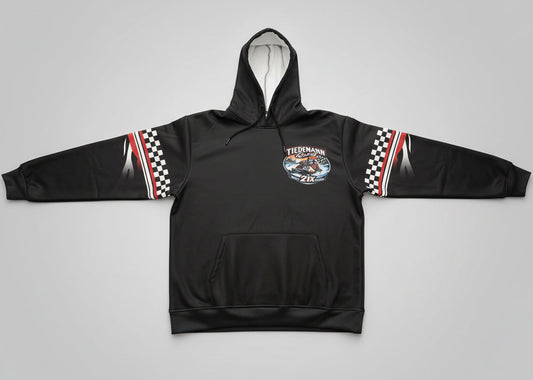 Black hoodie with a logo on a bed