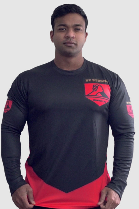 Person wearing a black and red athletic shirt with a logo on a plain background