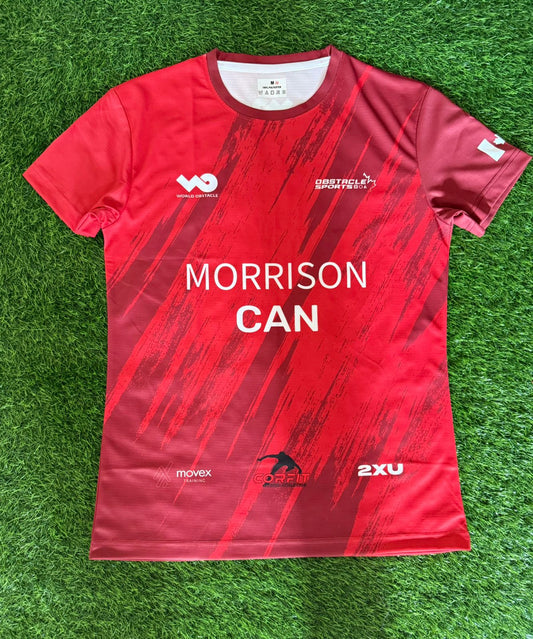 Red sports jersey with 'Morrison Can' text on a green grass background
